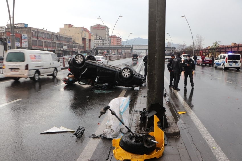 Takla atan otomobilden burnu bile kanamadan kurtuldu